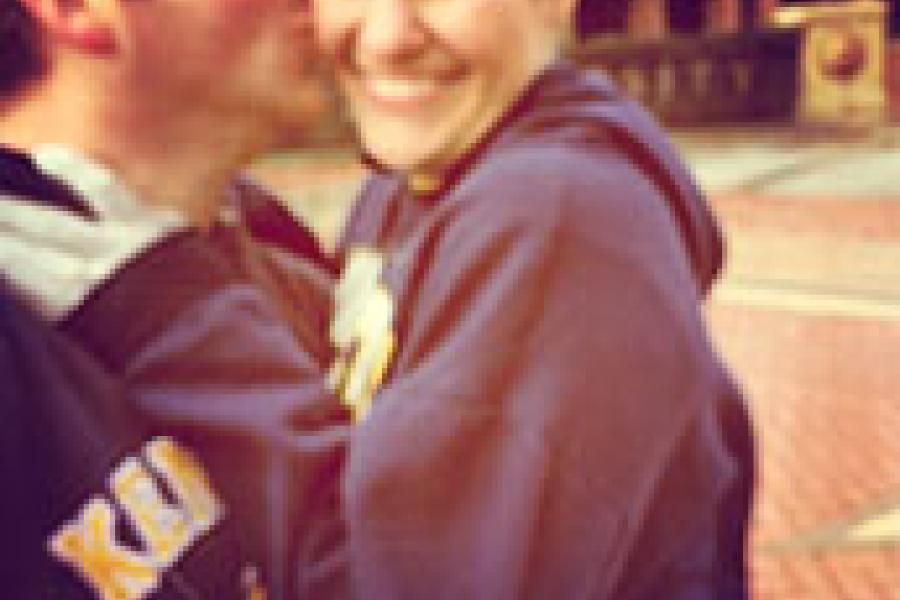 Kristen and Nicholas on Kent State main Campus embraced in a hug, smiling