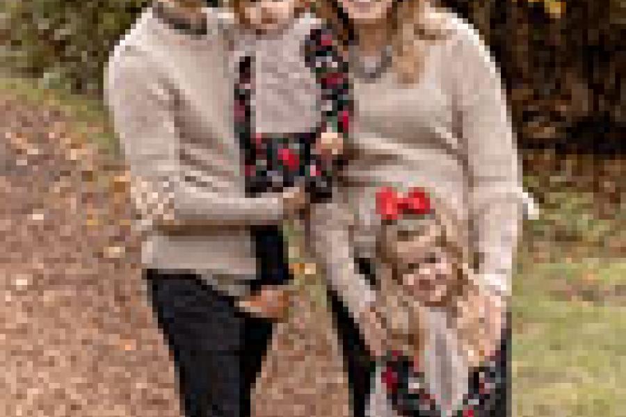 Melissa and Curt and their two daughters on a fall day