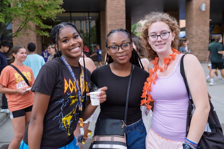 Three students smiling at the camera while attending the 2025 Blastoff event