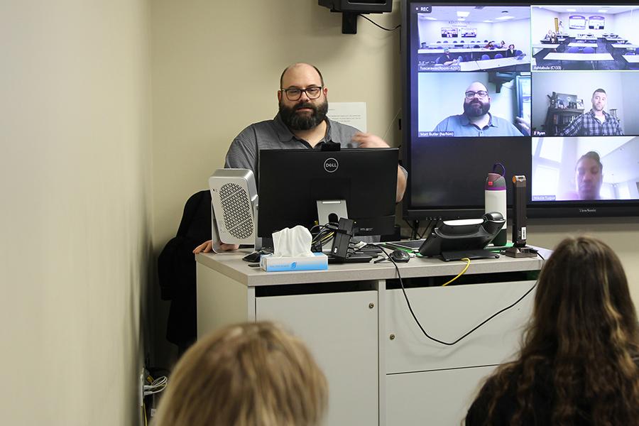 BSW program director and lecturer Matt Butler teaches a class from the Ashtabula Campus Zoom Room to students at three regional campus locations