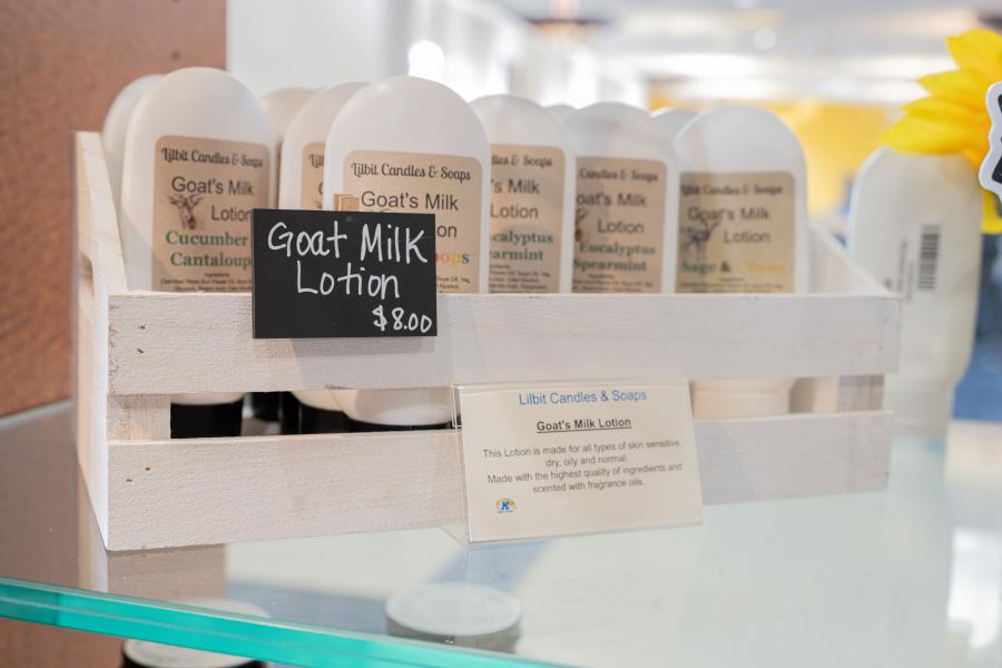 Close up of goat milk lotion, a merchant product at the Community Corner