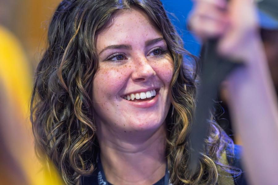 Close up of a student's smiling face while attending the 2025 Convocation event