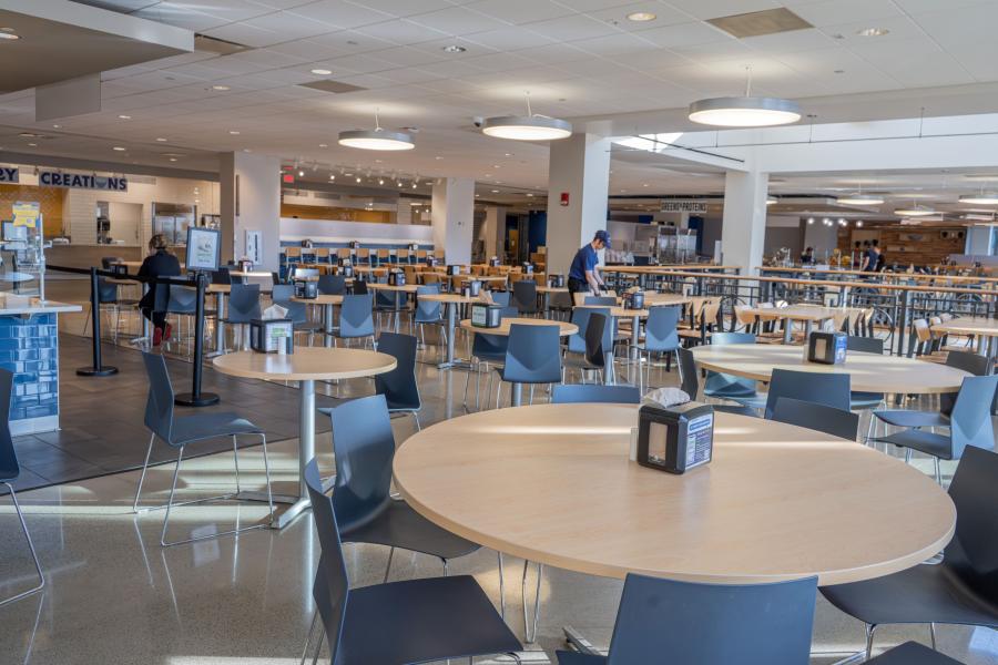 Wide shot of the main seating area in Eastway Dining Hall, mostly consisting of tables