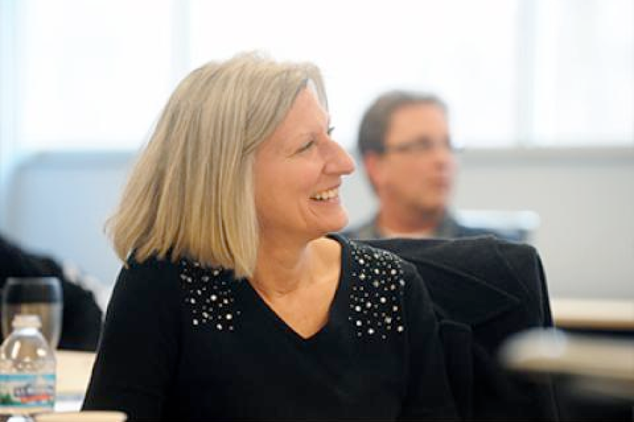 A program participant pays close attention to a speaker.