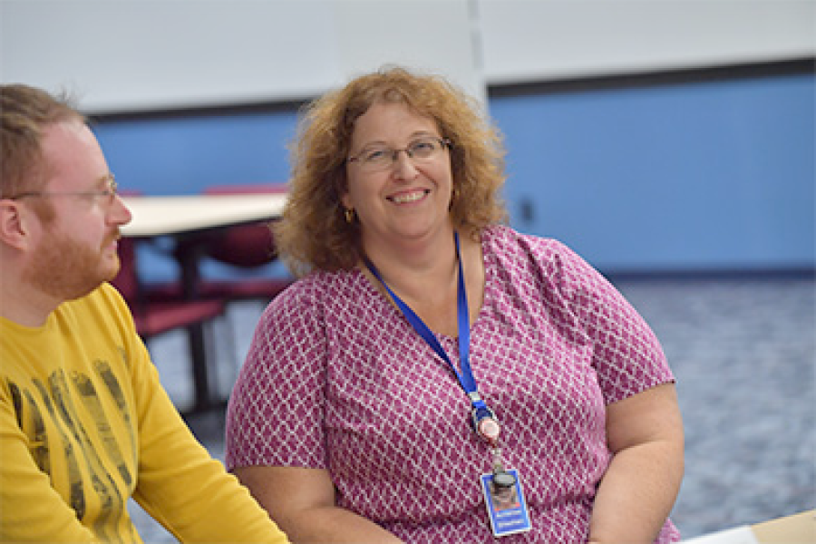 A program participant smiles at the camera.