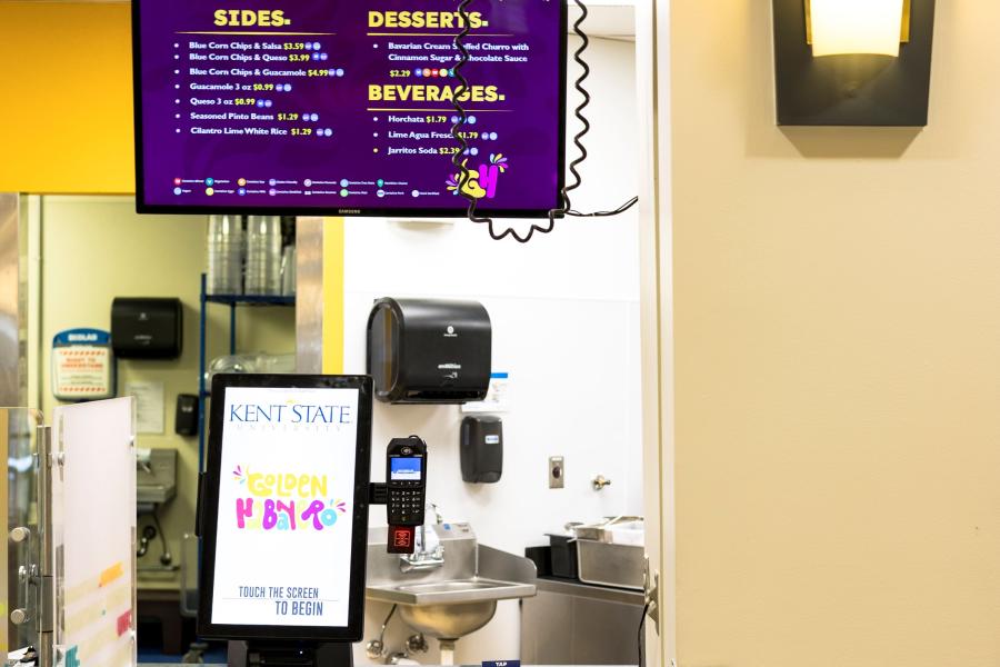 Close up of the ordering station at Golden Habanero, including an order kiosk and a menu screen