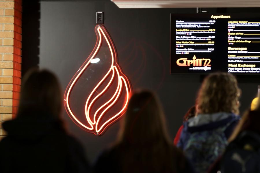 Grill '72 logo (a stylized flame) decoration on one of the walls within Grill '72