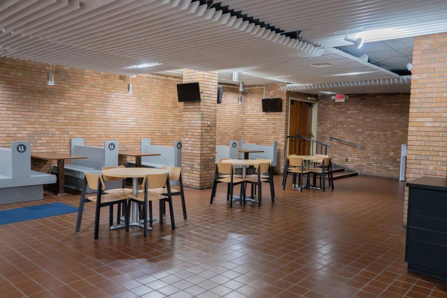 Seating area to the left of the order counter at Grill '72, consisting of both tables and booth options
