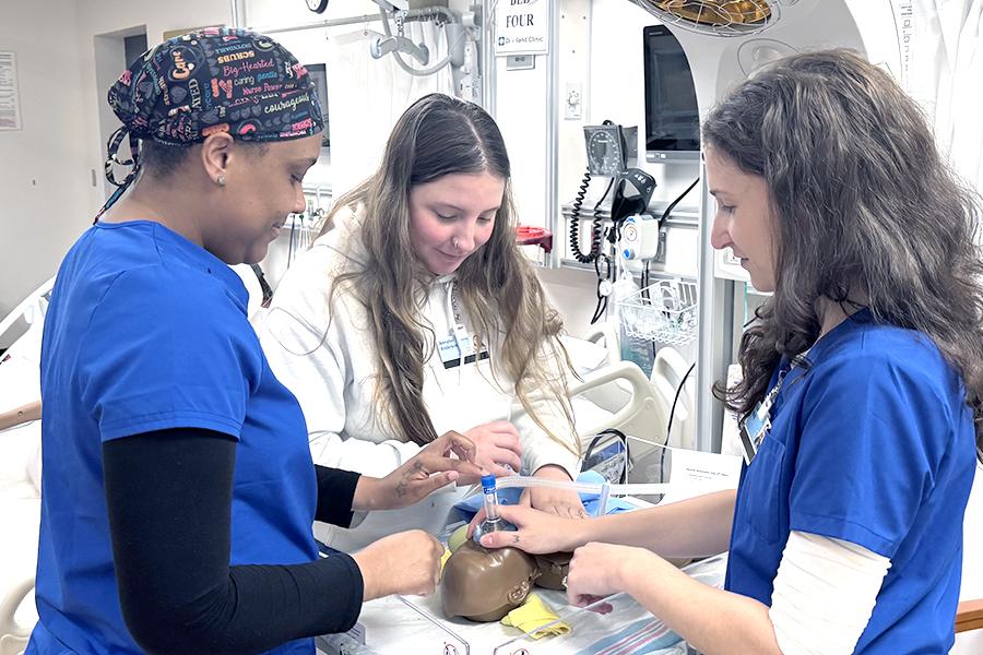 Respiratory Therapy Students practice with a patient simulator in a Cleveland Clinic lab as СƬƵ Ashtabula's satellite campus