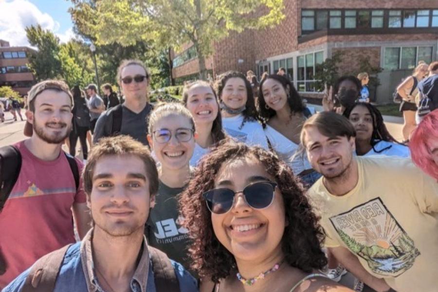 Leah taking a selfie with a group