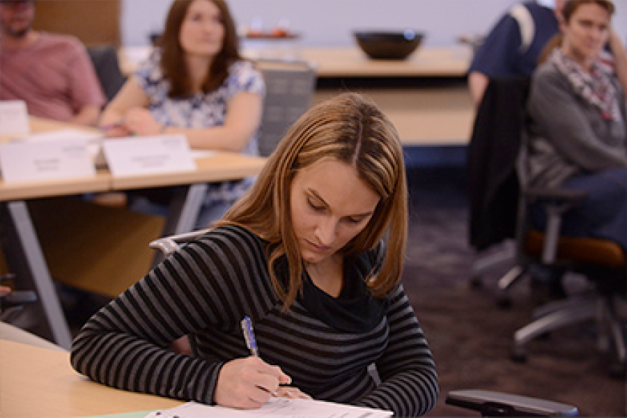 A program participant takes notes.
