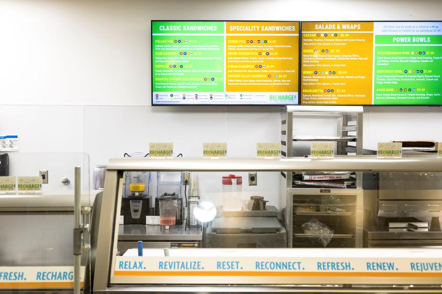 Close up of Recharge's prep counter, blenders, storage racks, and oven