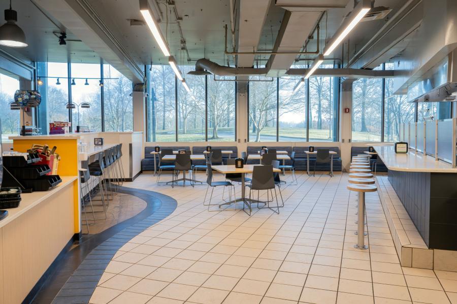 Wide view of available counter seating and table seating at Rosie's Diner, including a condiment station off to the left side