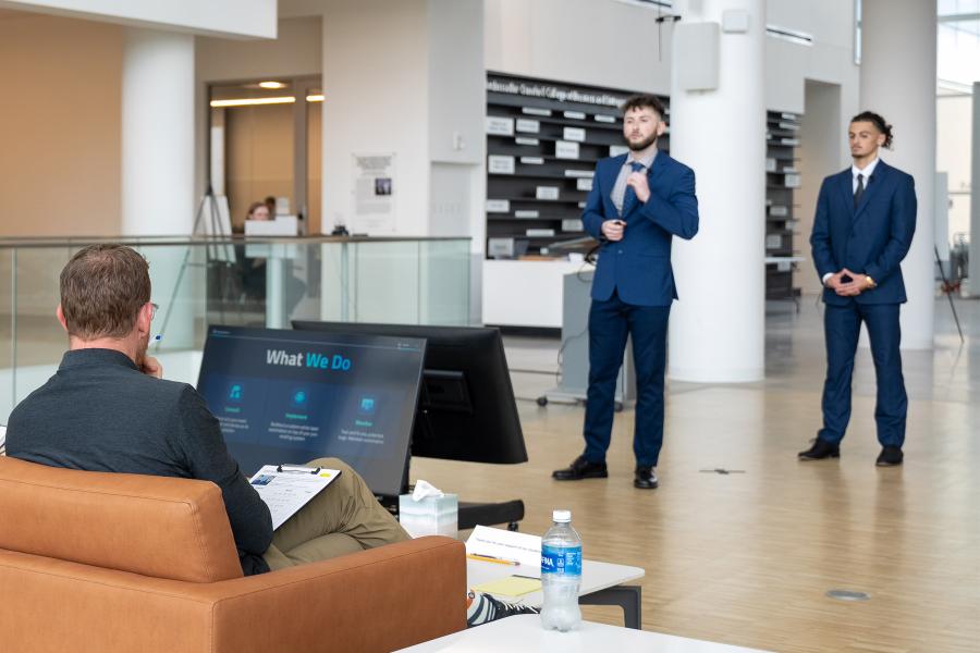 Students pitch their business to a team of entrepreneurial judges shark-tank-style. 