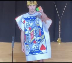 Blake solves Rubik's cube one-handed on stage