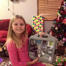Kendall Myers, age 10, with her first microscope