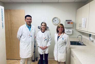 Wayne stands with fellow doctors