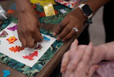 Kent State students volunteer to assist residents with a craft project at Tamarack Ridge