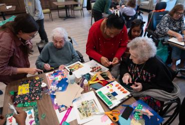 Kent State students volunteer to assist residents with a craft project at Tamarack Ridge