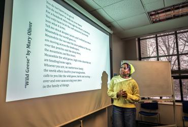 A student in Clare Stacey's class discusses a poem in Merrill Hall