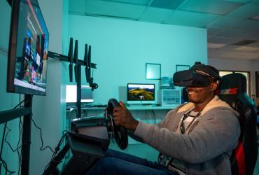 Sampson Addae in a driving simulation experiment in Jungyoon Kim's lab on the Kent Campus