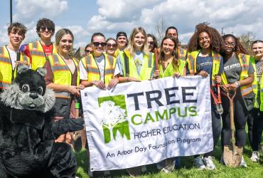 Volunteers pose during Arbor_Day_Planting_2026