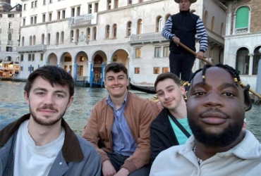 Joshua posing with fellow students while studying abroad