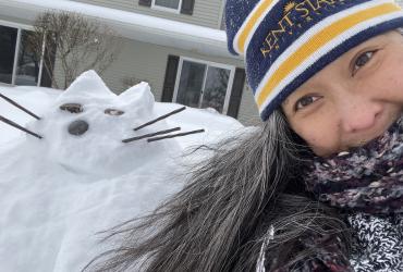 Mahli Mechenbier and the snow version of her cat.