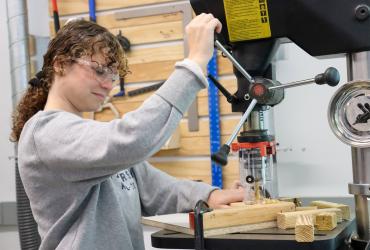 photo of student working in wood shop