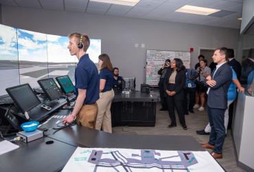 Jackson in the air traffic control lab with Pete Buttigieg