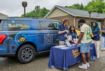 Mobile Flashes students provide fresh produce during a community event. (Photo credit: Rami Daud, Kent State University)