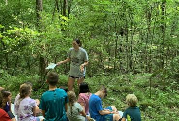 Olivia teaching kids at camp