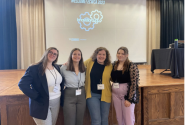 Savannah in a group photo at a national conference