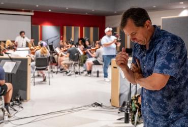 Scott Hallgren listens during Kent State collaboration for film score