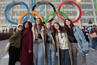 Alex Newnes and friends in front of the Olympic Rings.