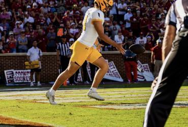 football player running ready to kick