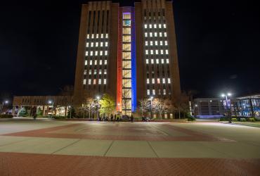 The Kent State University Library, lit in red, white and blue for Veterans Day