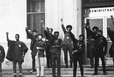 Members of Black United Students (BUS) stand in front of the Administration building (currently Cartwright Hall) in silent-protest 