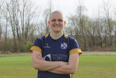 A photo of Sam in her rugby uniform