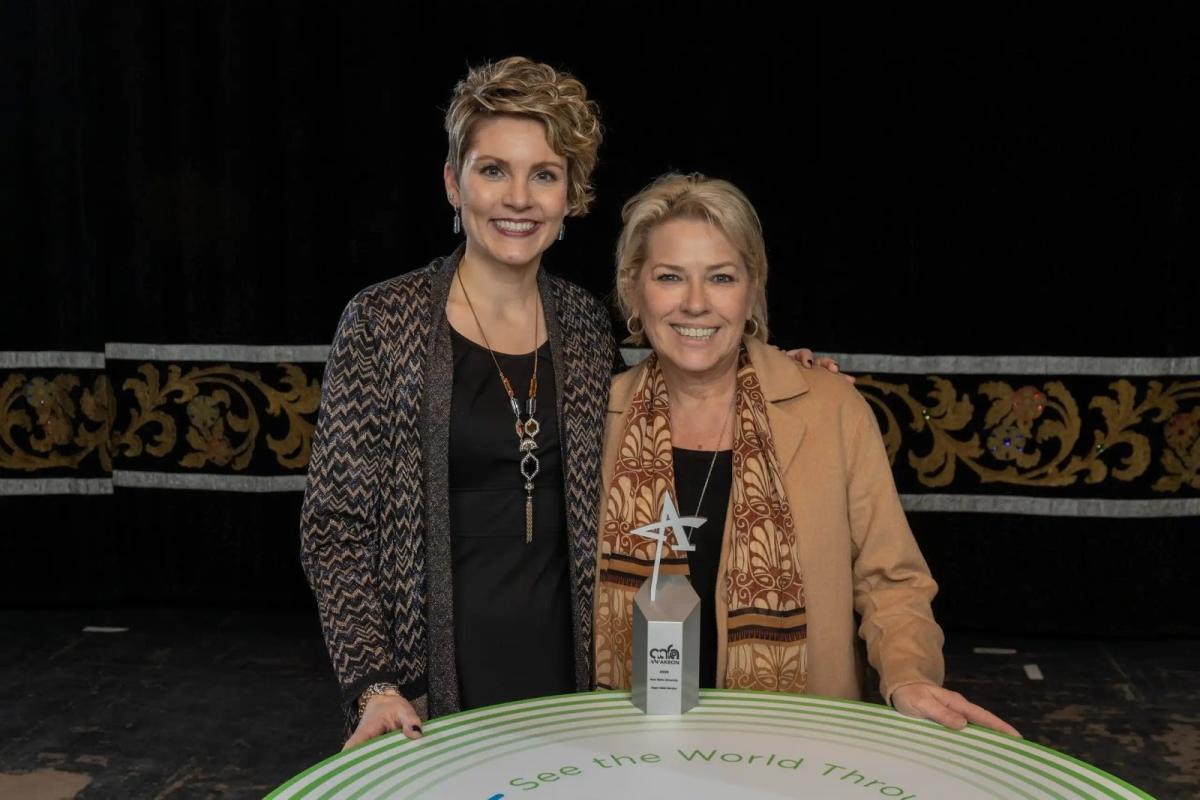 Leigh Greenfelder and Valoree Vargo smile after Kent State’s Division of Institutional Advancement took home its first ADDY, a silver award, for the Support Global Education video project. (Photo credit: Smithberger Photography)