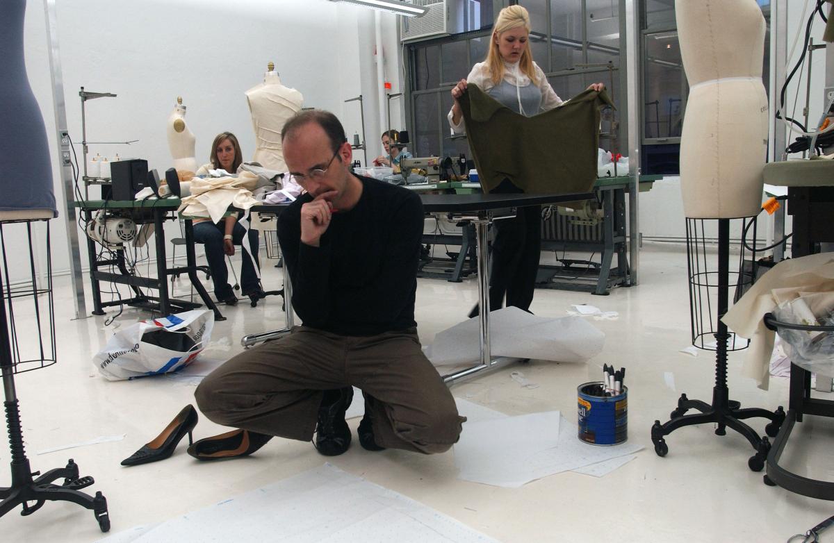 Then part-time instructor and fashion designer R. Scott French examines student work during an evening class at Kent State University’s New York City Fashion program in April 2006. French is a member of Kent State’s School of Fashion National Advisory Board and a 2005 inductee into the school’s Hall of Fame.