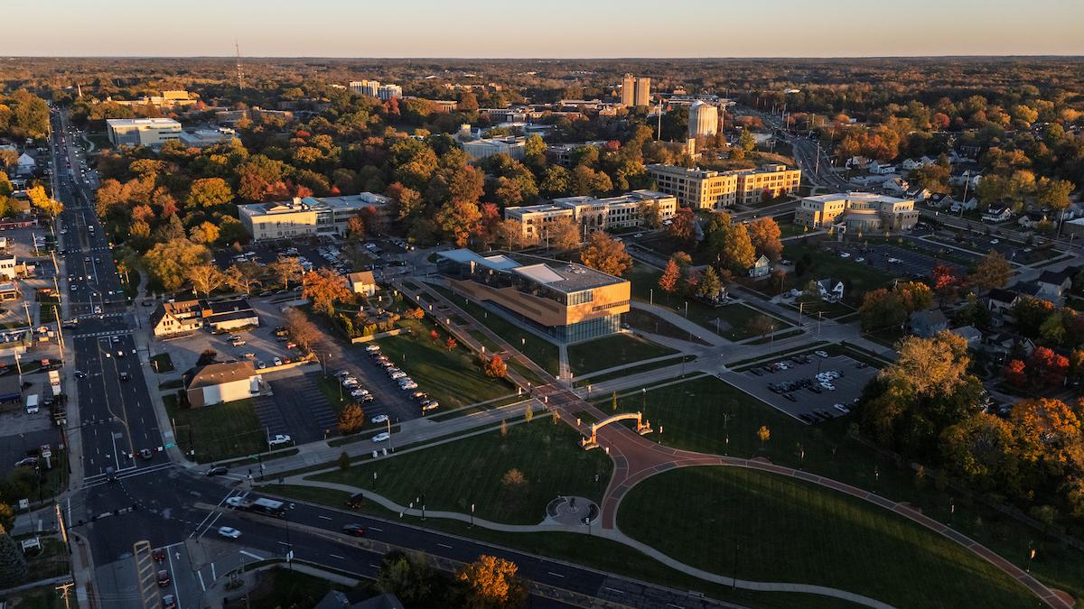 Drone shot of the Kent Campus in fall, featuring the Lefton Arch and the College of Architecture and Environmental Design