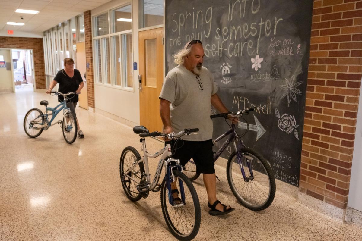 Workers from Family and Community Services of Ravenna collect bikes at Kent State's Tri-Towers Residence Halls