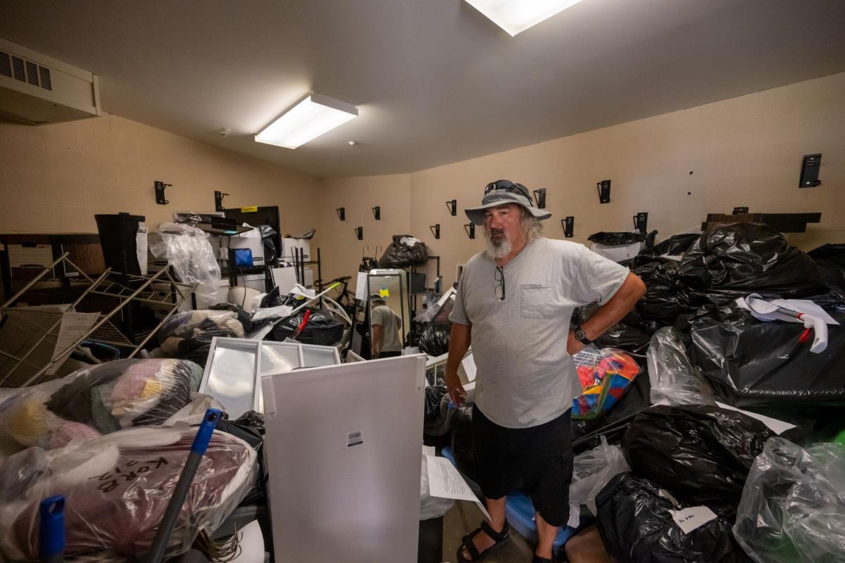 Kevin Ruble, an employee of Family and Community Services in Ravenna, stands in the storage room at Centennial Hall looking over the array of items to be collected for the needy.