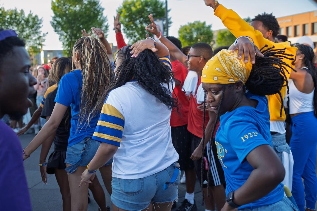 Students in a sorority line up and do a performance while at 's Blastoff event.