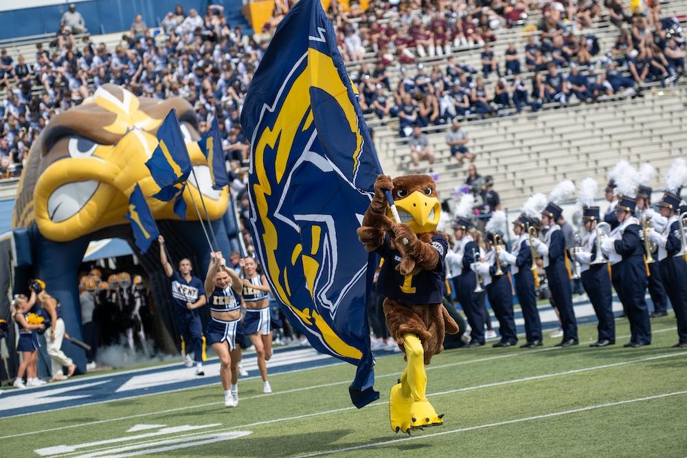 Flash with flag at Dix Stadium opening the KSU vs Buffalo football game