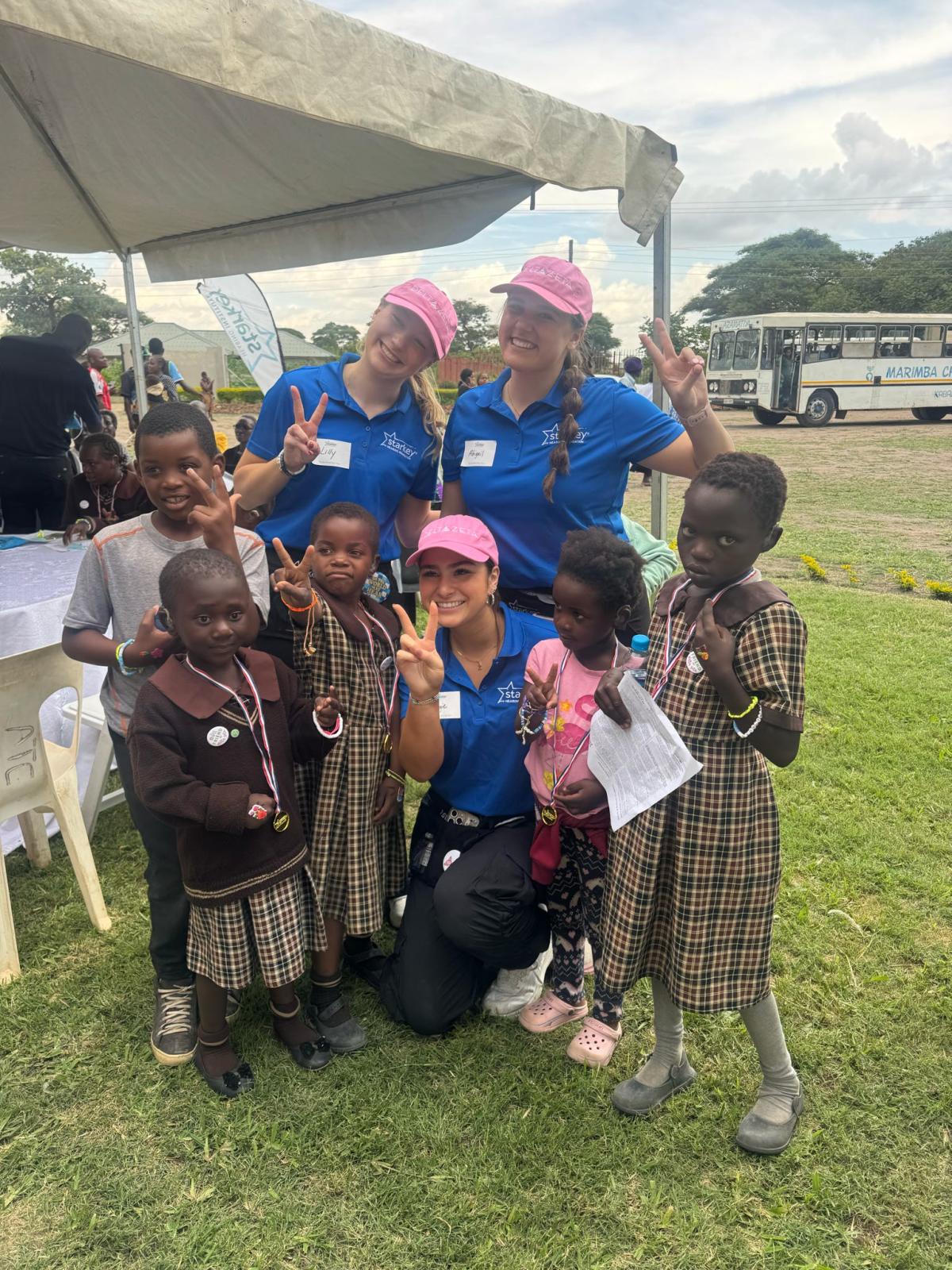 McCullough and other Delta Zeta members meet children in Zambia.