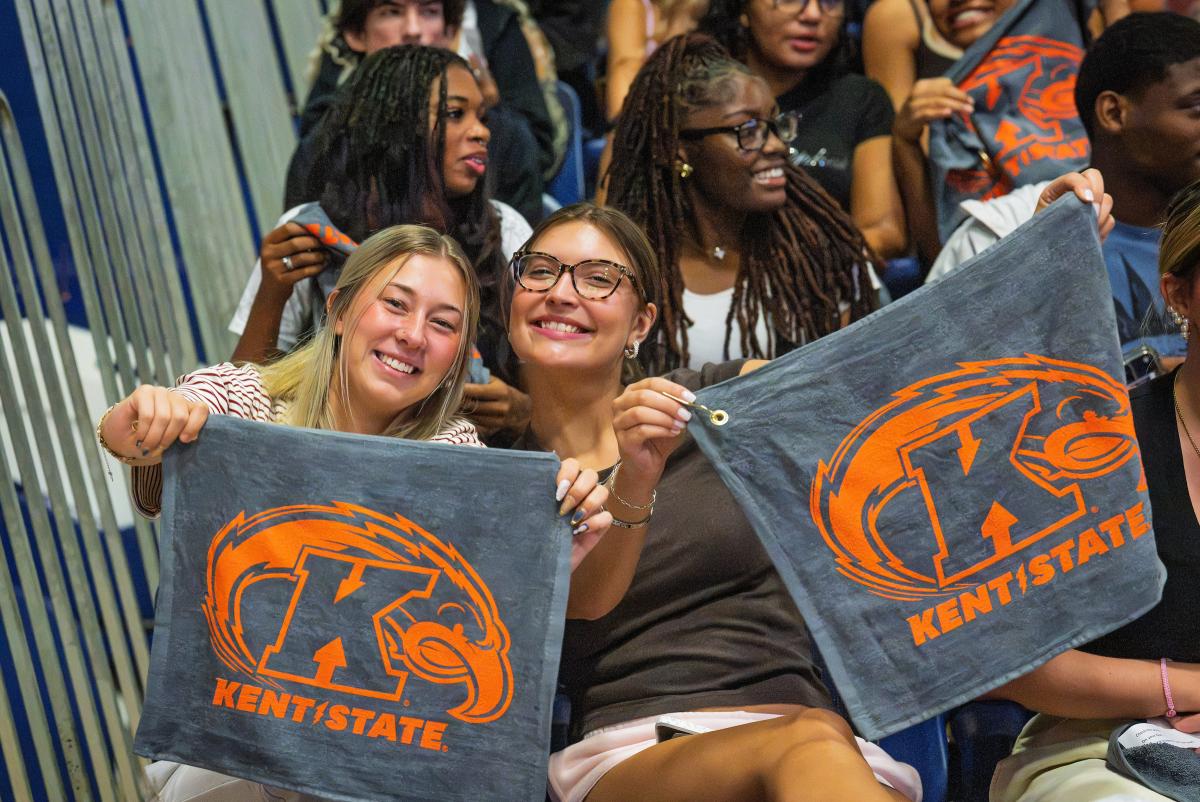 Two Kent State University first-year students smile during 2026 Convocation. (Photo credit: Rami Daud, Kent State University)
