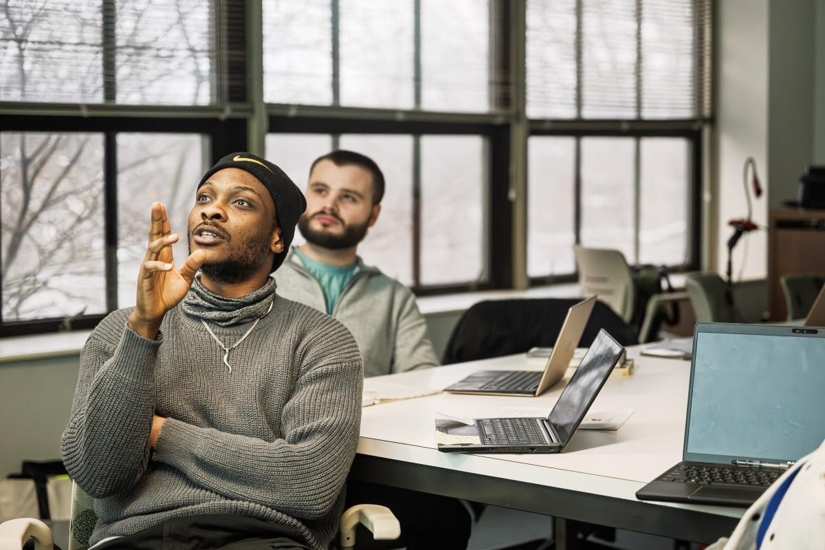 Students in Clare Stacey's class discuss a poem in Merrill Hall