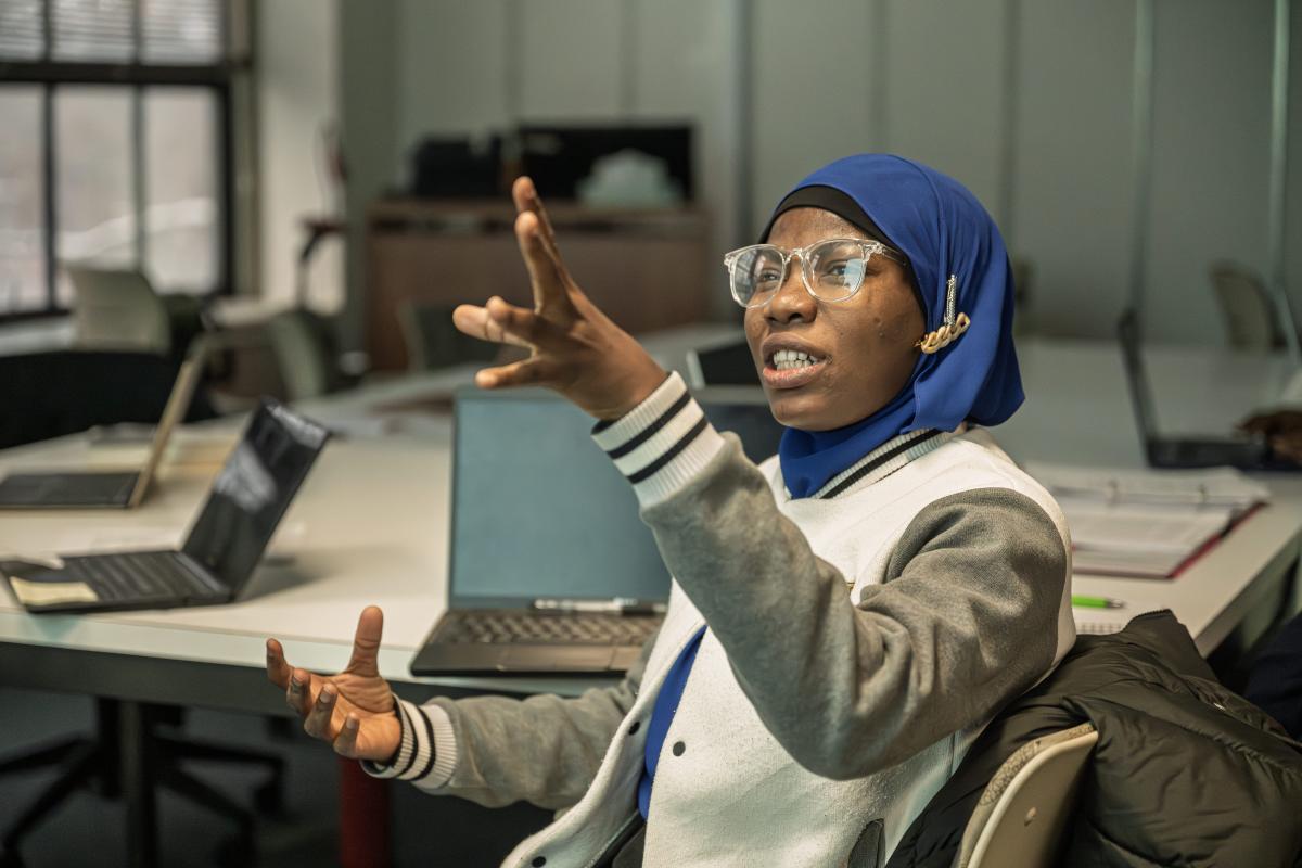 A student in Clare Stacey's class discusses a poem in Merrill Hall